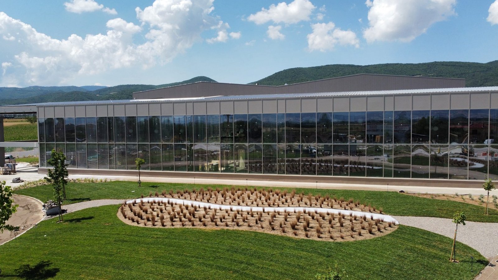 Coffee production facility — glass curtain wall exterior